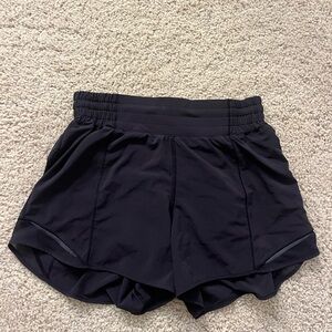 Lululemon black Hotty Hot High-Rise Shorts 4". Size 6 in women’s.